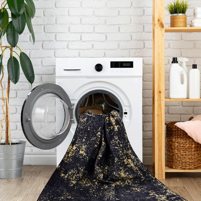 Maval - 8' X 10' Washable Area Rug - Black / Gold